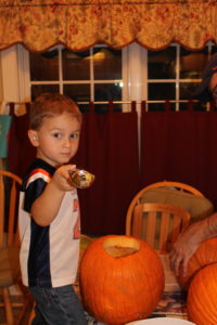 Little man carving his pumpkin in 2016. What a difference a year makes!