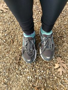 running shoes on wooded trail health margin